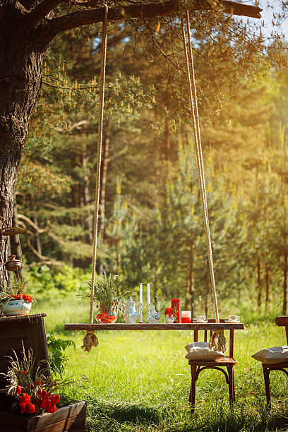 istock Decor Romantic dinner with  candles,flowers in green forest 508901350