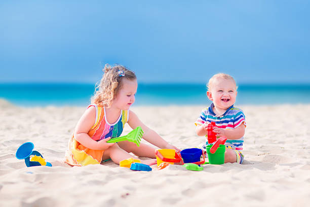 istock Kids playing on the beach 508906315