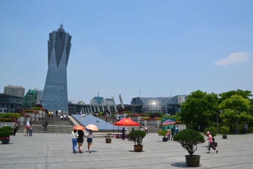 Hangzhou, China - May 2, 2014: local people walking at West Lake Cultural Square, a big complex housing museums and art centers.