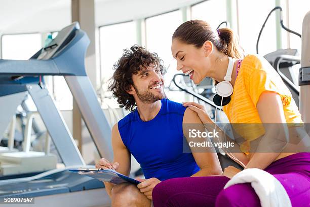 Woman With Personal Trainer In The Gym Stock Photo - Download Image Now - 20-29 Years, 30-39 Years, Activity