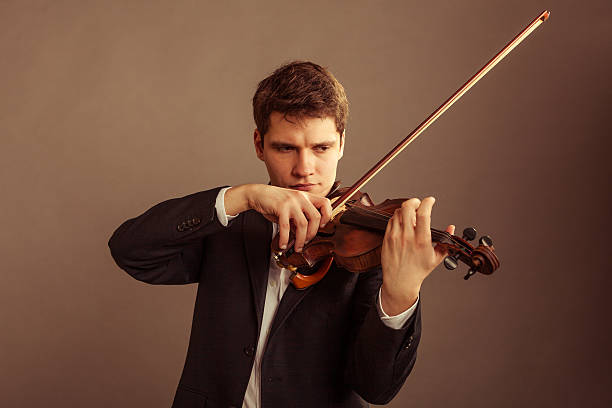 istock Man violinist playing violin. Classical music art 508908283