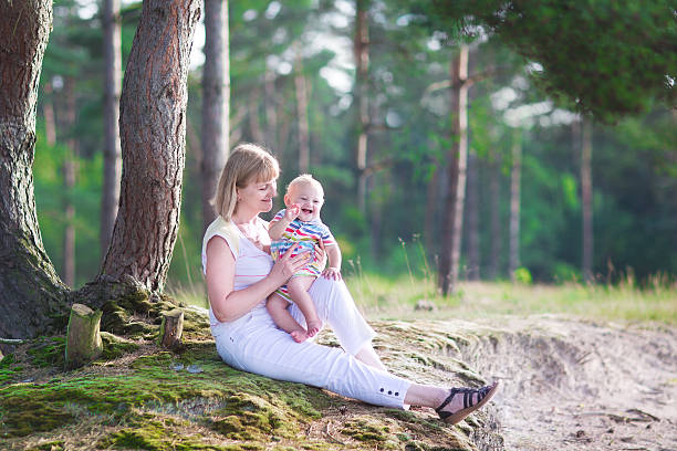 istock Beautiful woman playing with a baby 508908353