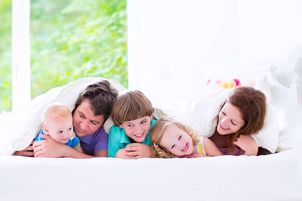 istock Adorable happy big family in a bed 508908433