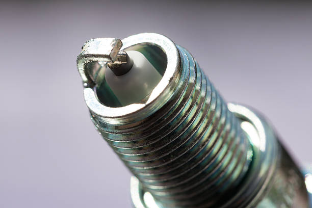 istock Auto service. New spark plug as spare part of car. 508909927