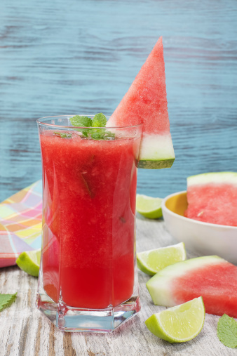 Garnish with thin slices of watermelon and a pinch of mint.