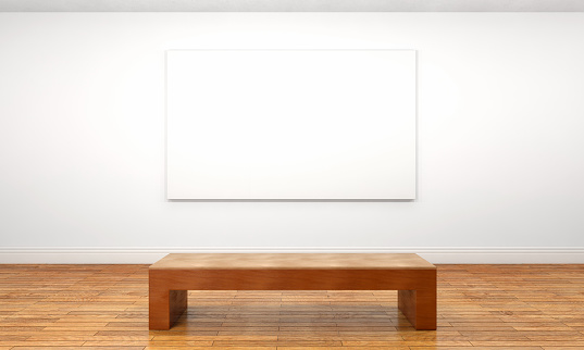 Empty customizable blank canvas hanging on a wall inside a private space or museum gallery, with a wooden bench in front of it. Bright illumination with white walls and brown parquet floor. Unframed canvas can be customized with any image that fits inside its borders. Front view. Digitally generated image.