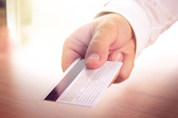 istock Man's hand holding a credit card 508916038