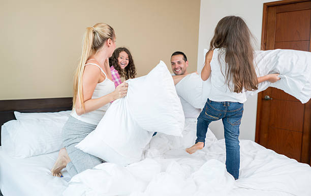 istock Happy family having a pillow fight 508918220