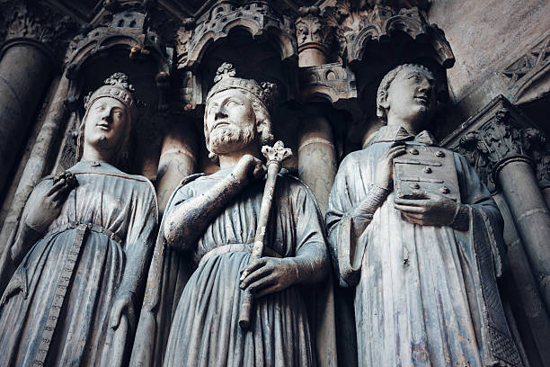 Gothic Background with Ancient Kings and Saints. Sculptures and Architecture Details of Cathedral Saint-Germain l'Auxerrois. Paris, France.