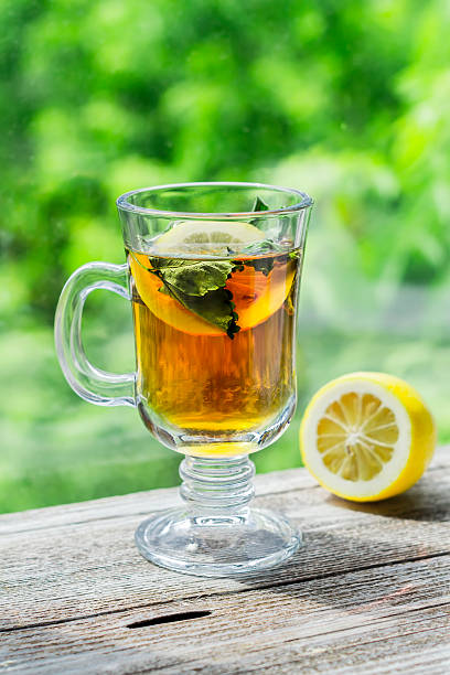 istock Tea with lemon and mint in glass cup 508919076