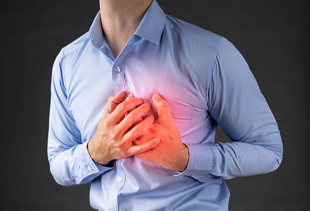 istock man holding his heart in pain 508919716