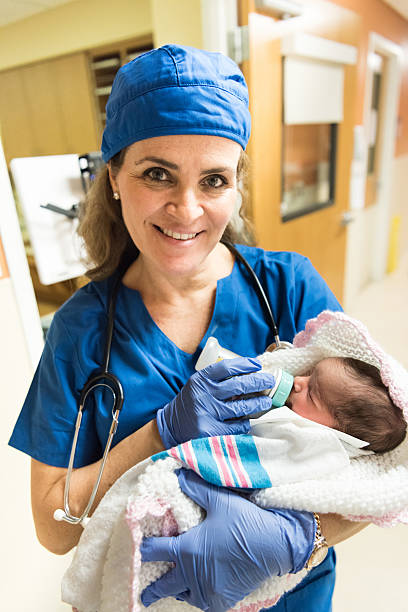 istock Nurse feeding a newborn 508921784