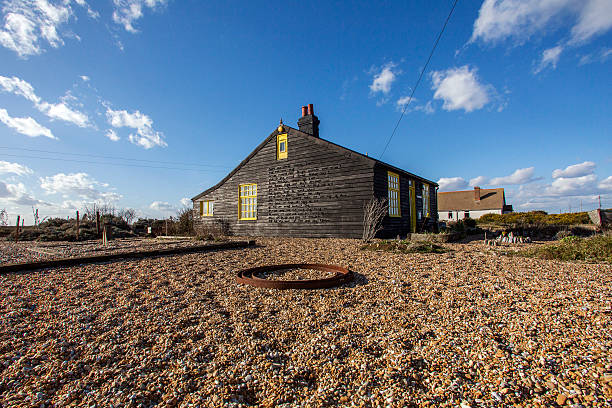 Dungeness, England, UK: March 02, 2015: Prospect cottage, owned by Derek Jarman (1942-1994) was an English film director who made a famous garden on the shingle shore near Dungeness nuclear power station.