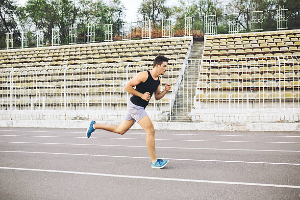 istock Man running on a racing track 508939698