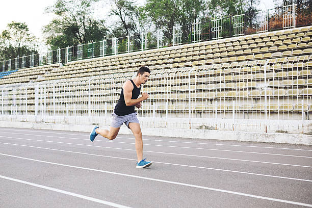 istock Man running on a racing track 508939788