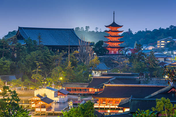 Hiroshima, Japan - December 2, 2015: The Itsukushima Shrine complex at dusk. The present shrine dates from the mid 16th century with origins traced as far back as the 12th century.