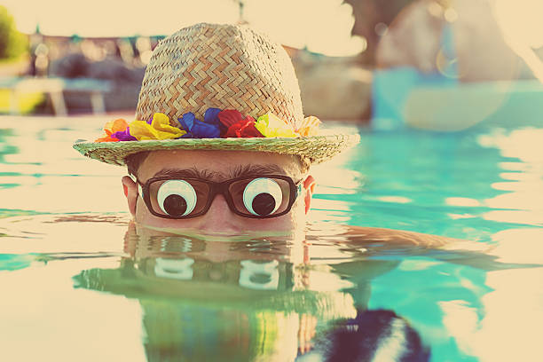 Portrait of bizzarre tourist Portrait of bizzarre tourist  in swimming pool. Slective Focus stock pictures, royalty-free photos & images