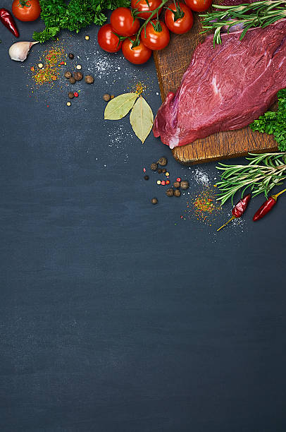 istock Raw meat on wooden cutting board 508942286