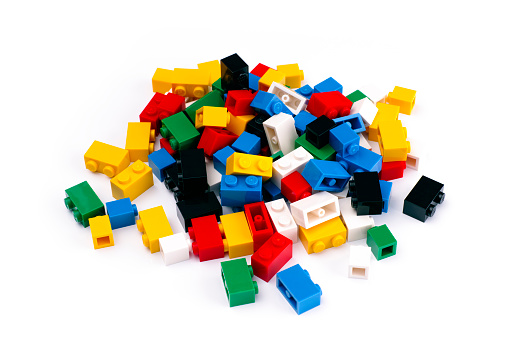 Tambov, Russian Federation - February 19, 2015: Heap of colorful Lego Blocks on white background. Studio shot.