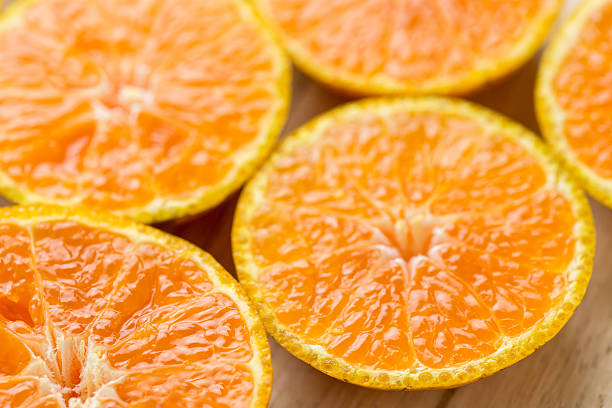 istock Slice fresh orange fruit  on wood background 508944118