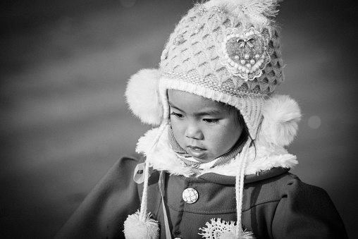 Vietnamese young girl with scarf and winter hat - ethnic and traditional people
