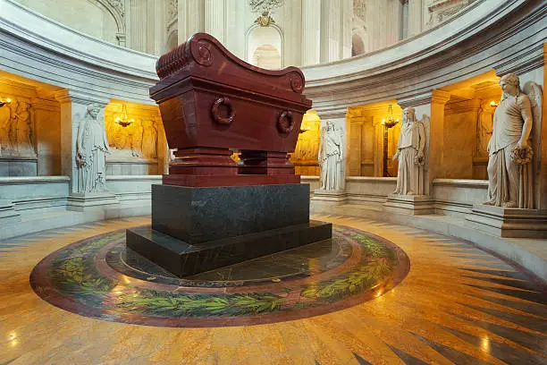Napoleon's remains were entombed in a porphyry sarcophagus in the crypt under the dome at Les Invalides
