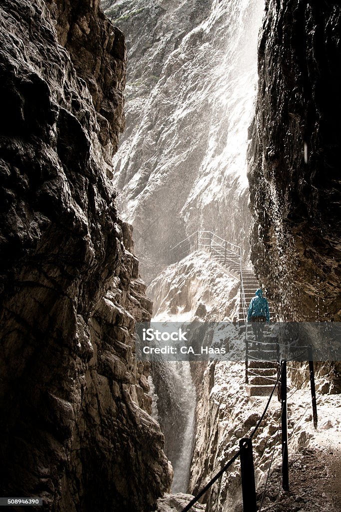 Enlightened Canyon Passing through the Höllentalklamm in rainy conditions, just when the sun comes up and mixes with the rain to a somewhat divine lght. Canyon Stock Photo