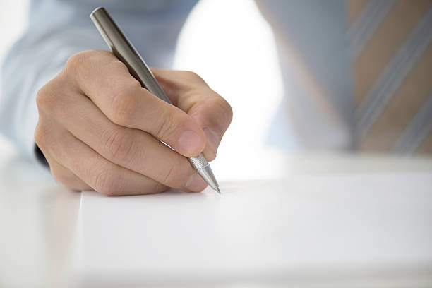 istock Man Signing Contract Paper 508946396