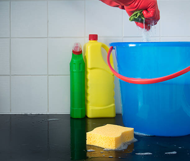 istock Squeezing a rag and cleaning the floor 508947210