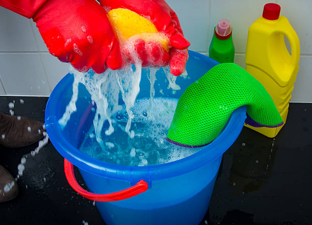 istock Squeezing the sponge and cleaning the floor 508947286