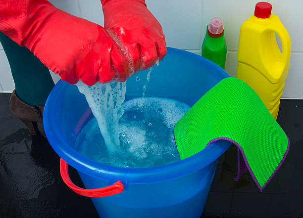 istock Squeezing the sponge and cleaning the floor 508947344
