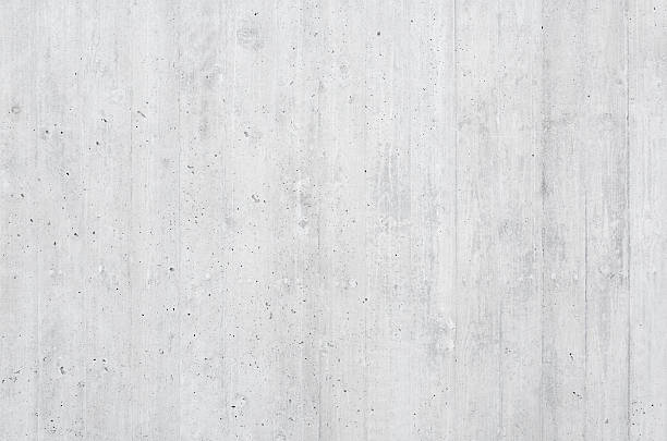 Background: high-quality board formed concrete wall Close-up of a high-quality board formed concrete wall with vertical wooden texture impressions. Soft lighting with excellent detail useful both as a background and as a high-frequency texture. concrete wall stock pictures, royalty-free photos & images