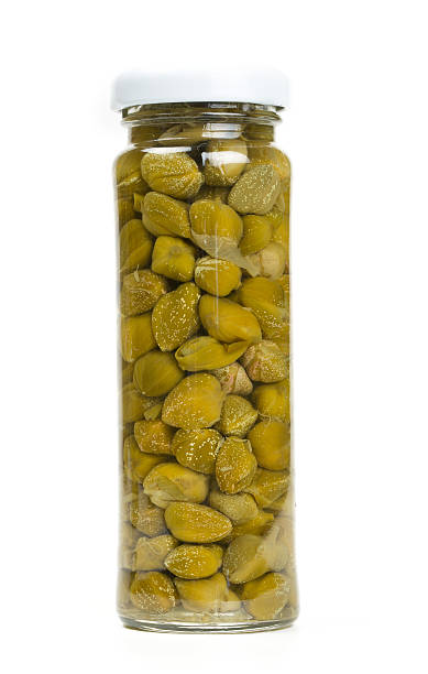 istock capers in a glass jar isolated on white 508948596