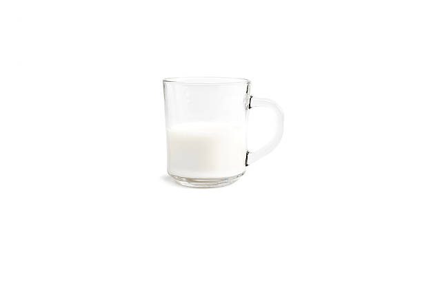istock glass mug half full of milk on a white background 508949784