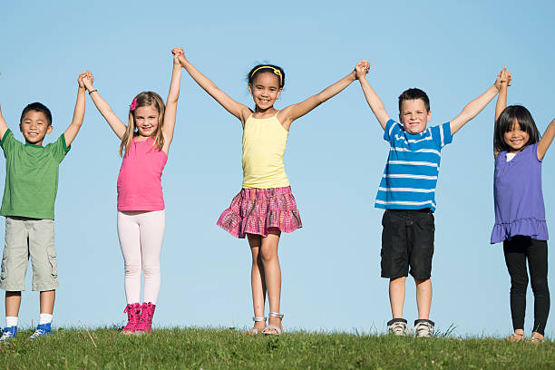 istock Children Standing on Top of a Hill 508950162