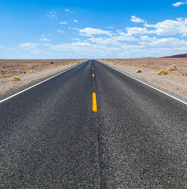 istock Death Valley road straight across the desert 508950896