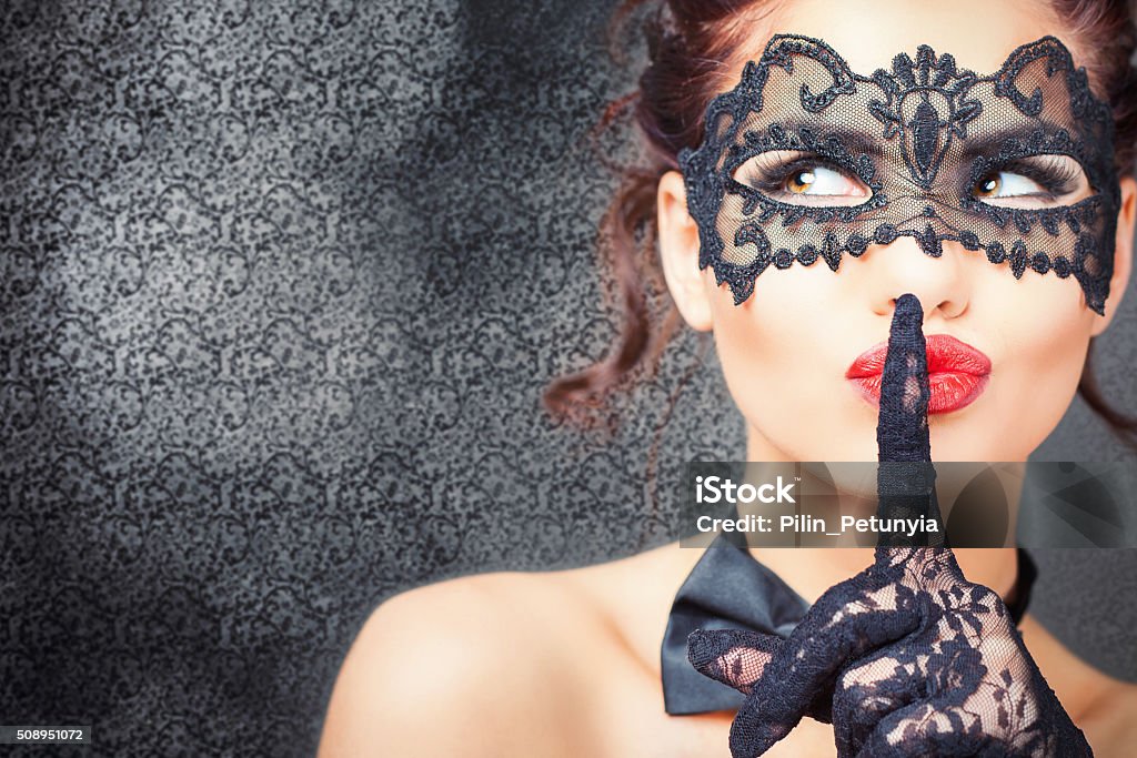 Sexy woman with carnival mask Sexy woman with carnival mask. Secret. Fashion. Venetian carnival. Sex shop. Hot babe. Party. Night background Sensuality Stock Photo