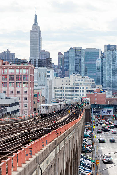 istock Subway Train Approaching  Elevated Subway Station in Queens, New York 508951086