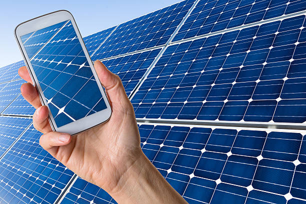 istock Smartphone in hand showing solar panels 508953202