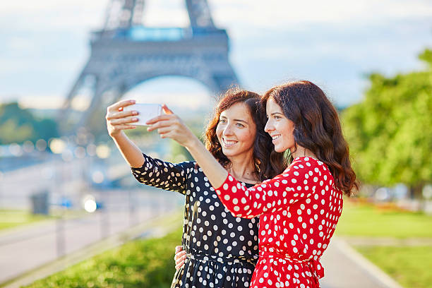 istock Beautiful twin sisters taking selfie in front of Eiffel Tower 508953596
