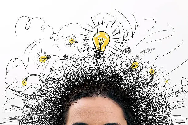 Photo of Thinking people with question signs and light idea bulb above