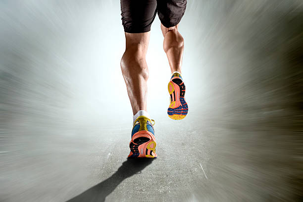 istock strong athletic legs  sport man running on motion grunge background 508954036