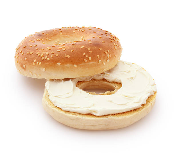 Bagel and Cream Cheese Bagel and Cream Cheese isolated on white (excluding the shadow) sesame bagel stock pictures, royalty-free photos & images