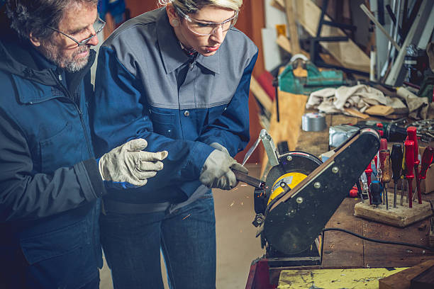 istock Woman Grinding Metal in Mechanical Workshop 508956090