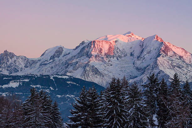 Beautiful panoramic view of Mont Blanc mountain in the Alps with orange sunset light