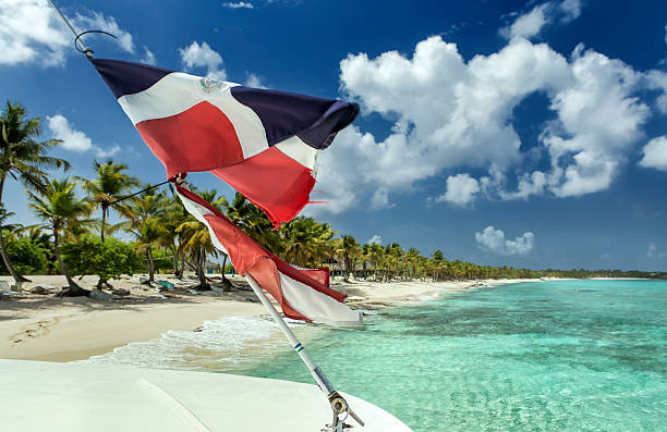 istock Dominican flag at caribbean sea 508958246