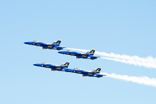 Mountain View, California, USA - February 8, 2016: Blue Angels leaving Moffett Field in a crystal clear blue sky after appearing at Superbowl 50 the day before. Airplanes are Fa-18 Hornets.