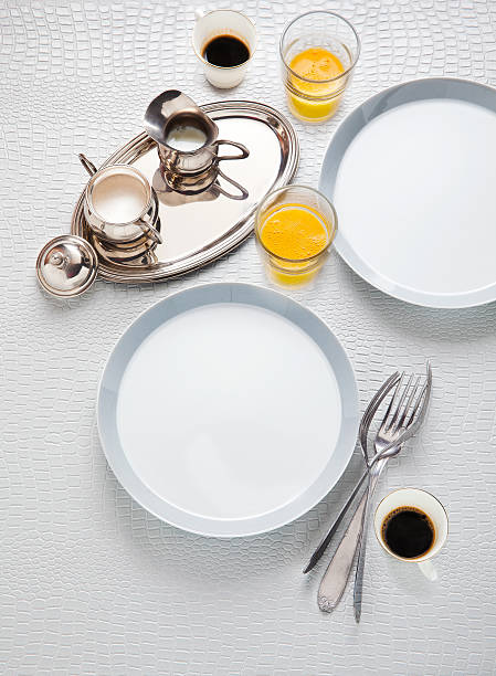istock empty plates for breakfast. fresh orange juice and coffee 508958972