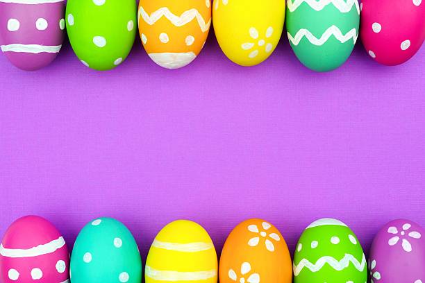 istock Easter egg double border over purple paper background 508959816