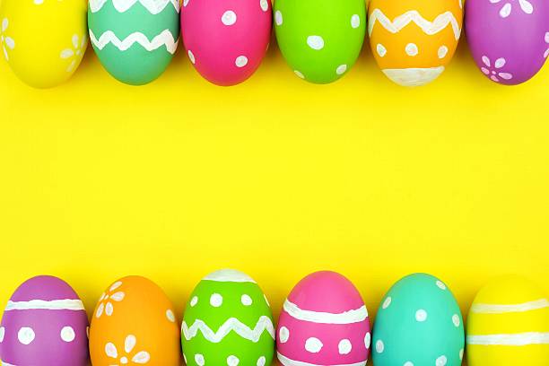 istock Easter egg double border over yellow paper background 508959858